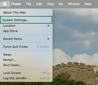 Apple menu open in macOS with System Settings option highlighted