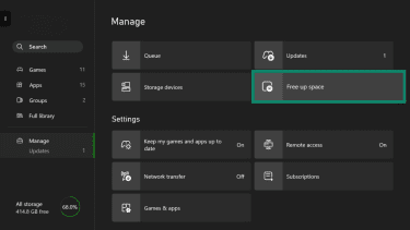 Xbox Settings menu with Manage selected and the Free up space option highlighted.